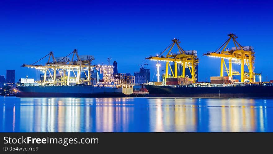 Industrial Container Cargo freight ship with working crane.