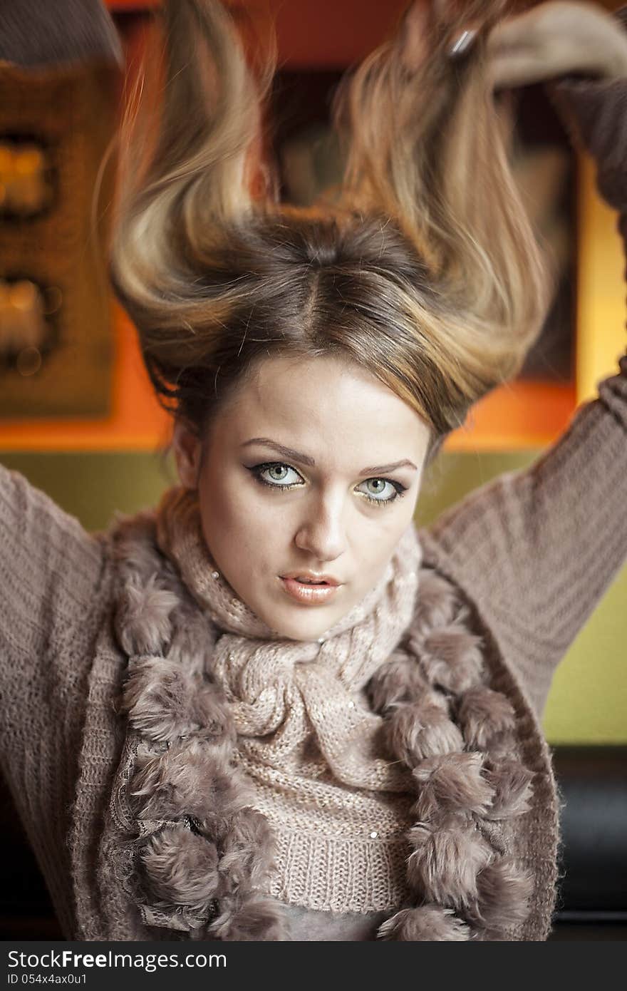 Portrait of a young woman staring straight ahead into the camera. Portrait of a young woman staring straight ahead into the camera