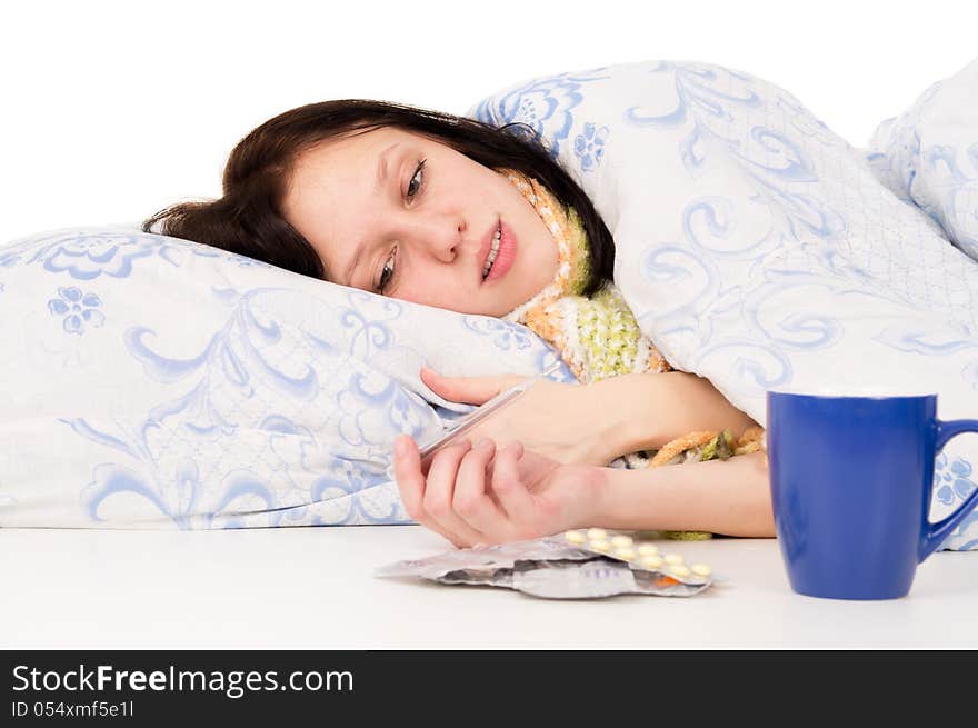 The diseased girl lying in bed on white background. The diseased girl lying in bed on white background