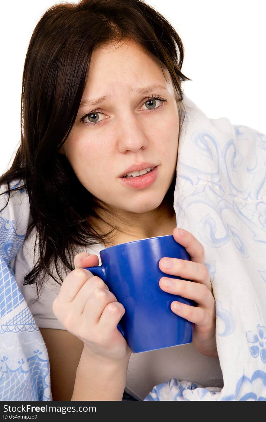 The diseased beautiful girl lying on the bed, and drink medicine on white background