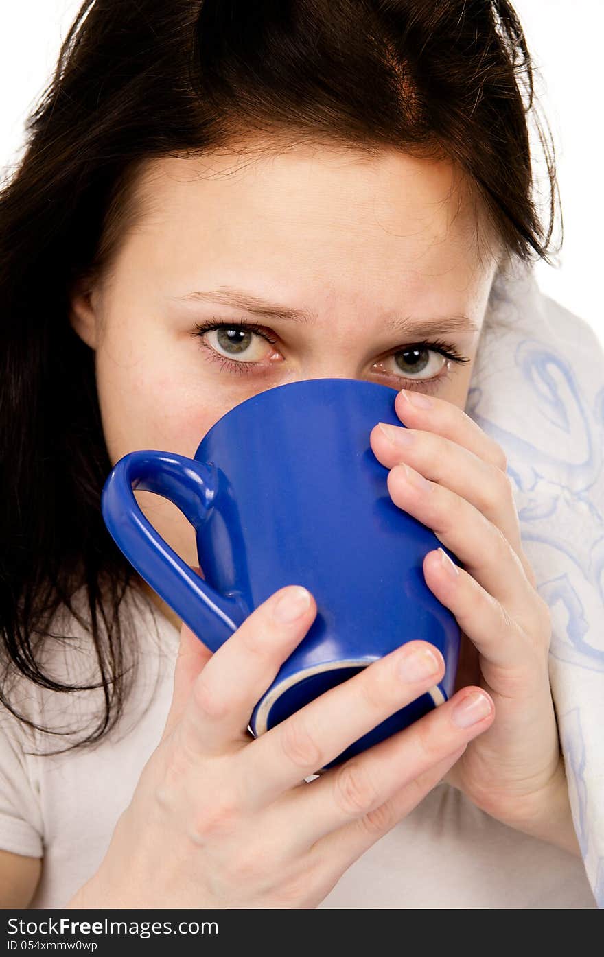 The diseased beautiful girl lying on the bed, and drink medicine isolated on white background