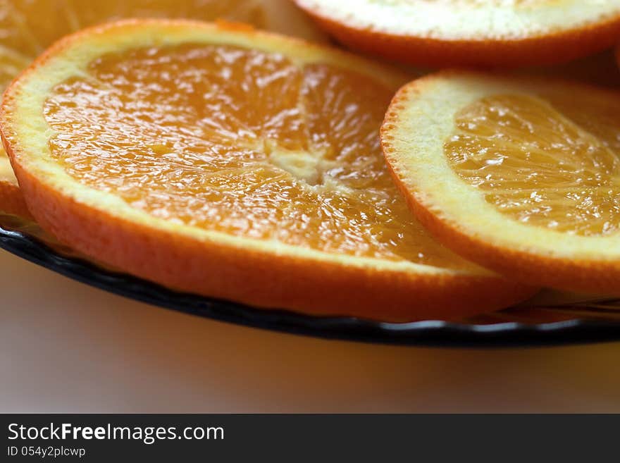 Orange segments on a plate.