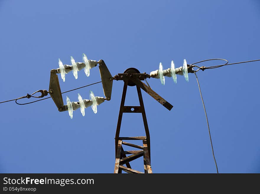 High-voltage insulator in the blue sky