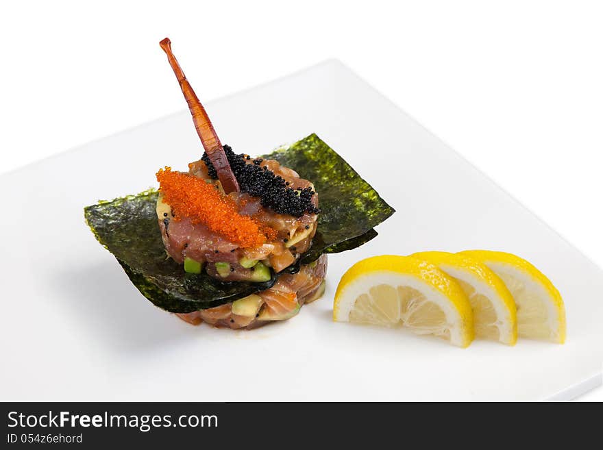 Originally decorated seafood dish, salmon, tuna and caviar. Originally decorated seafood dish, salmon, tuna and caviar