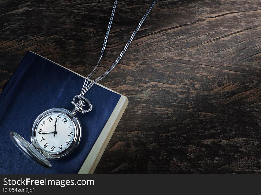 Pocket Watch On An Old Book, A Notebook.