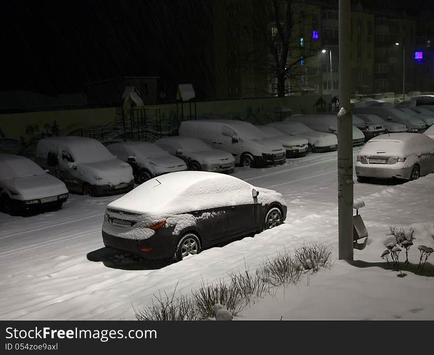 Car in the yard on a winter cold dark night