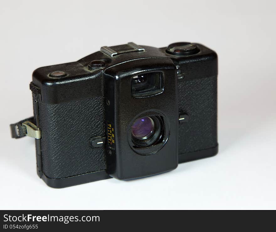 Retro vintage black camera on light background. Retro vintage black camera on light background