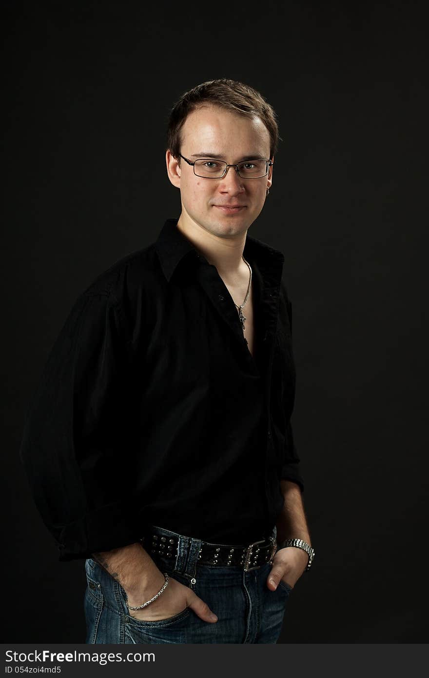 Portrait of young man posing standing in srtudio