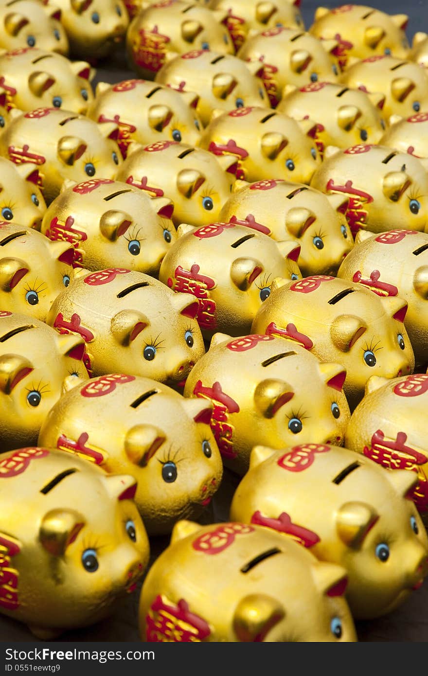 Lot of golden Chinese piggy banks. Lot of golden Chinese piggy banks