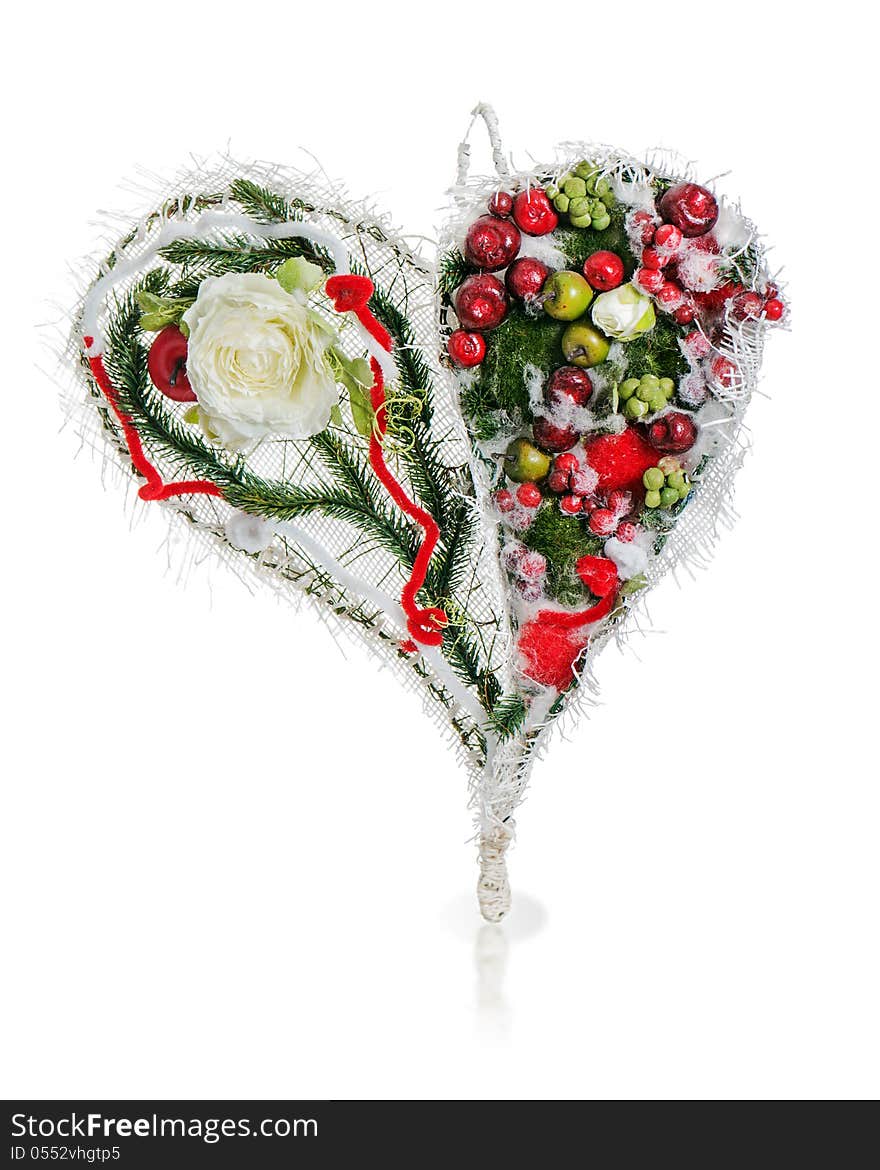 Abstract composition in the form of heart from apples, balloons, roses and pine needles isolated on white background