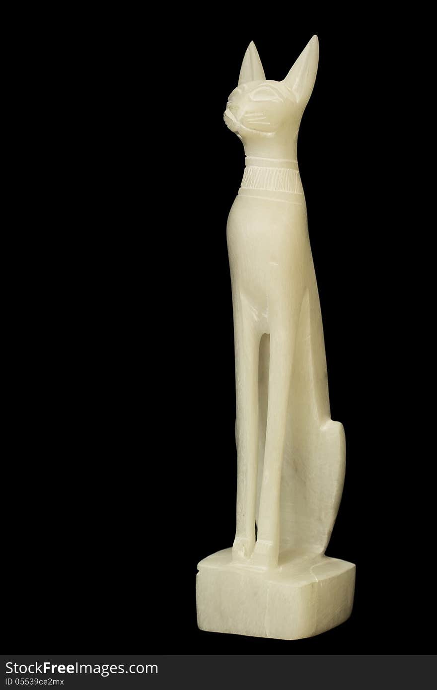 Statuette of the Egyptian god with the appearance of a cat. Made of jade (nephrite). Black background. Statuette of the Egyptian god with the appearance of a cat. Made of jade (nephrite). Black background.