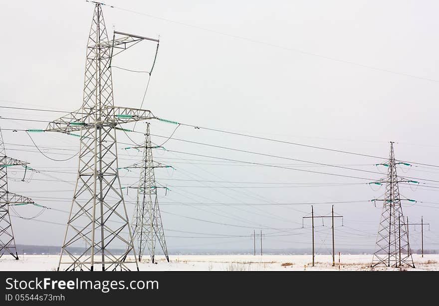 High Voltage Tower  On A Winter Background