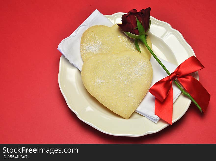 Love theme heart shape shortbread cookies with red rose.