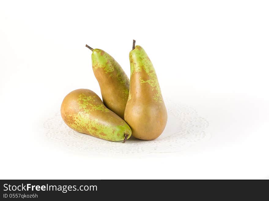 Pears. One sliced pear slices, another whole. Isolated on white background.