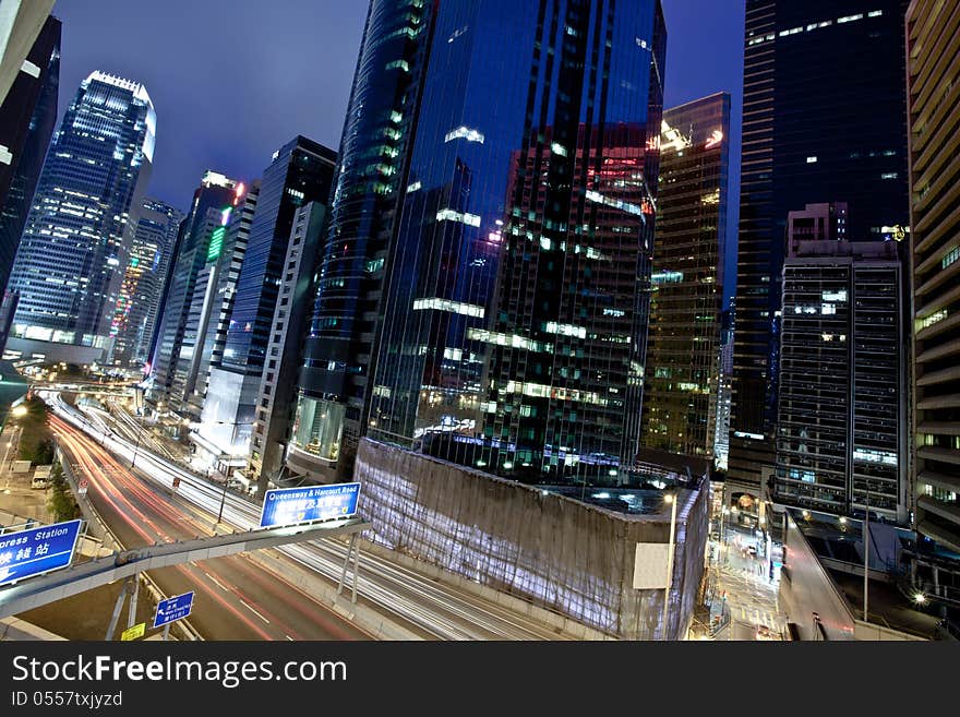 A view of the lights and skyscrapers in downtown Hong Kong at night