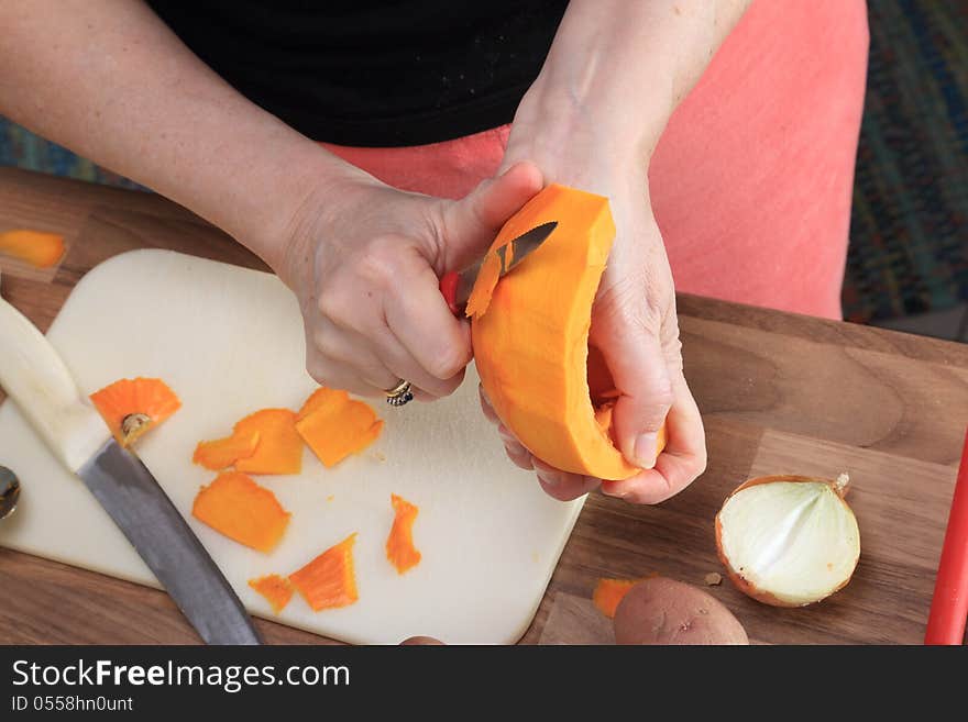 After doing away the inner parts of the pumpkin, it is peeled in order to make a delicious pumpkin soup. After doing away the inner parts of the pumpkin, it is peeled in order to make a delicious pumpkin soup