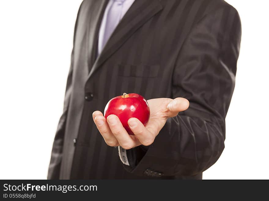 Male hand holding a red apple on white background