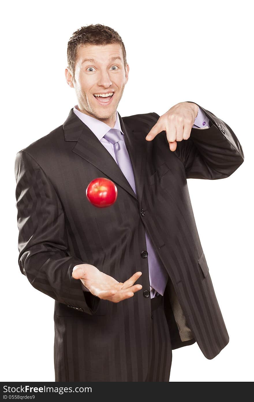 Businessman Tossing Apple on White Background