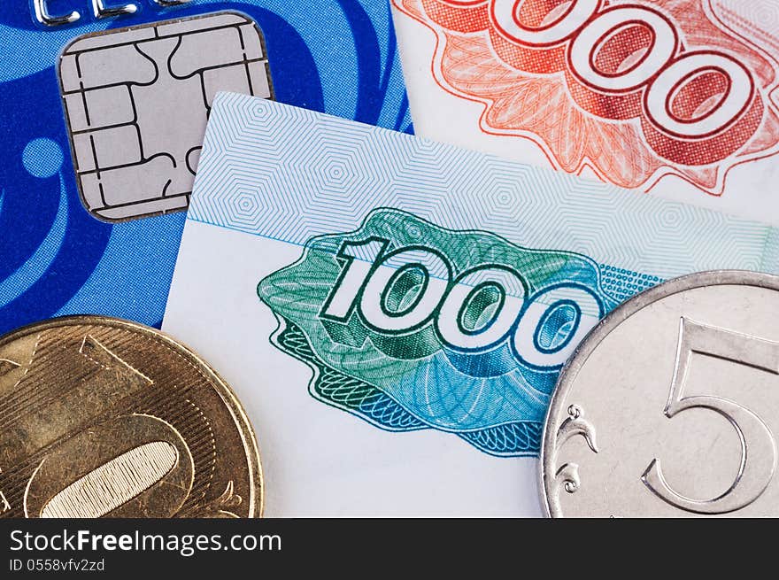 Credit card, banknotes and coins clouse up