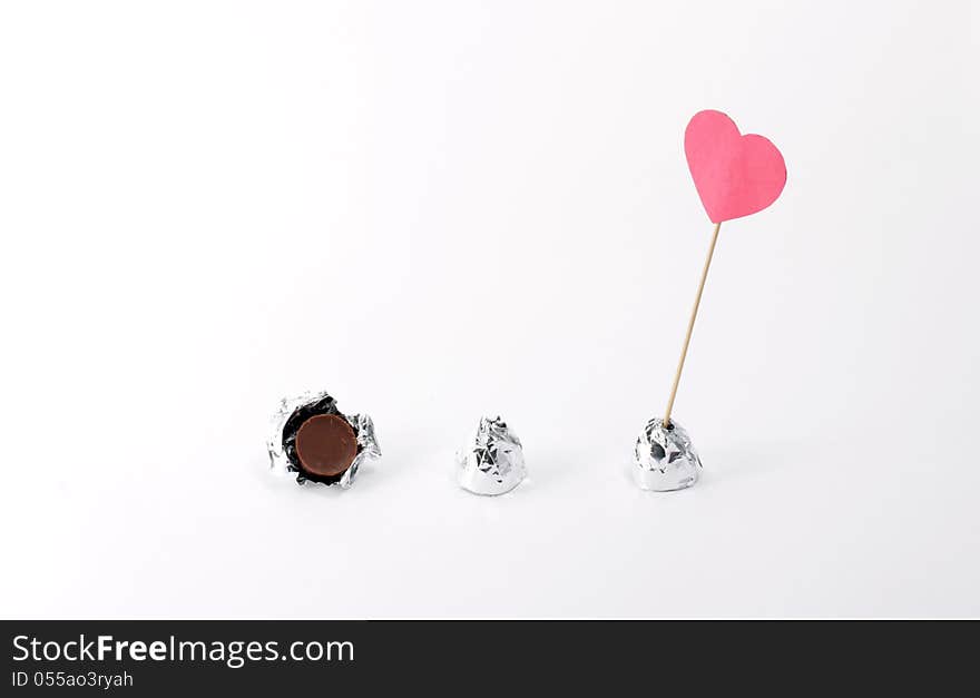 Sweet candy wrapped in foil and a sign of love. Sweet candy wrapped in foil and a sign of love