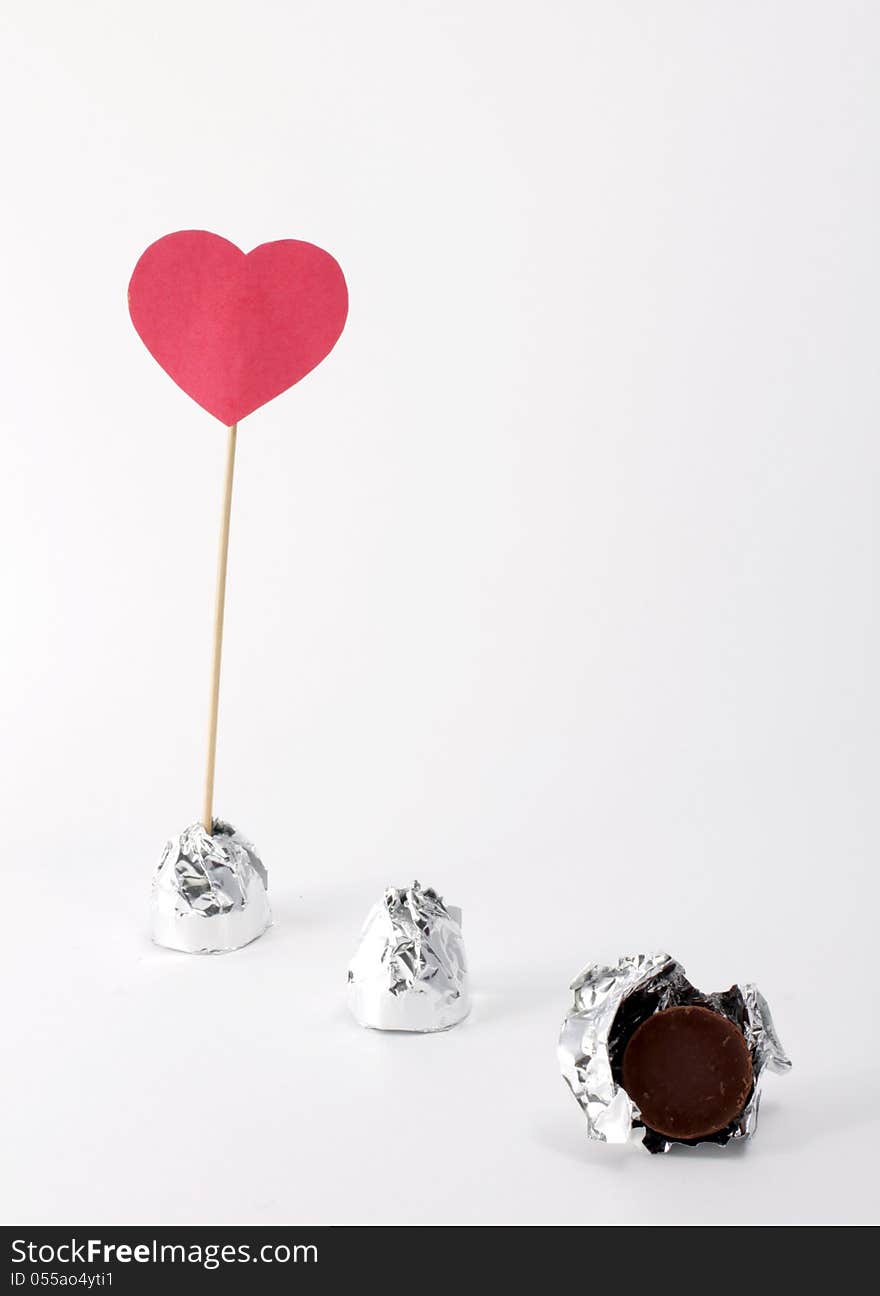 Sweet candy wrapped in foil and a sign of love. Sweet candy wrapped in foil and a sign of love