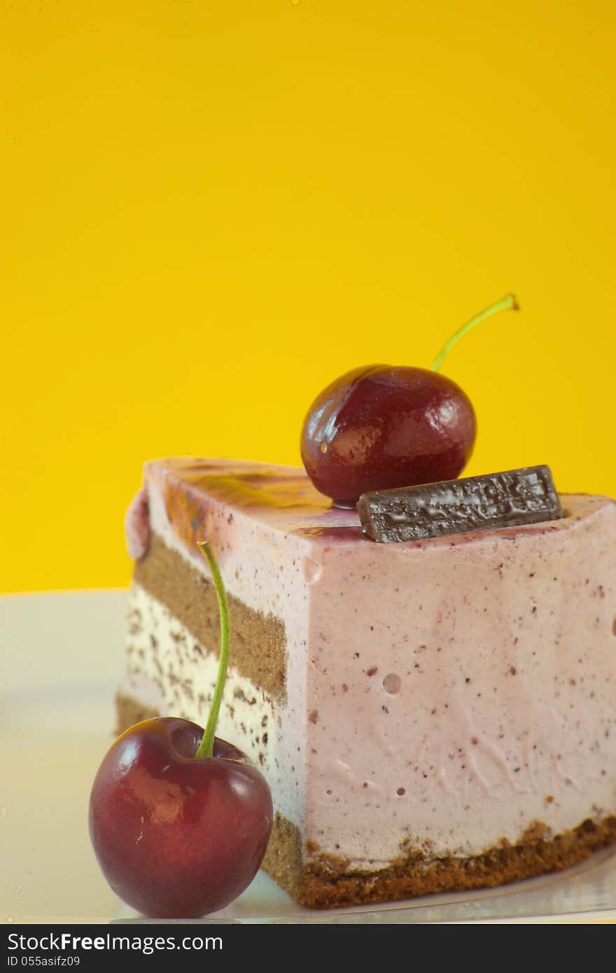 Close-up of a fruit cake on yellow background