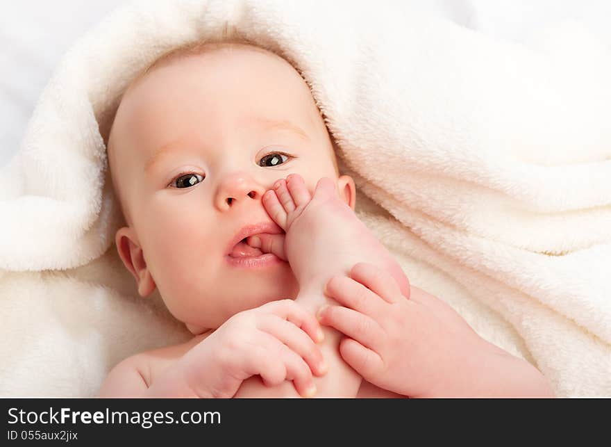 Small Baby Sucking Her Finger On Leg