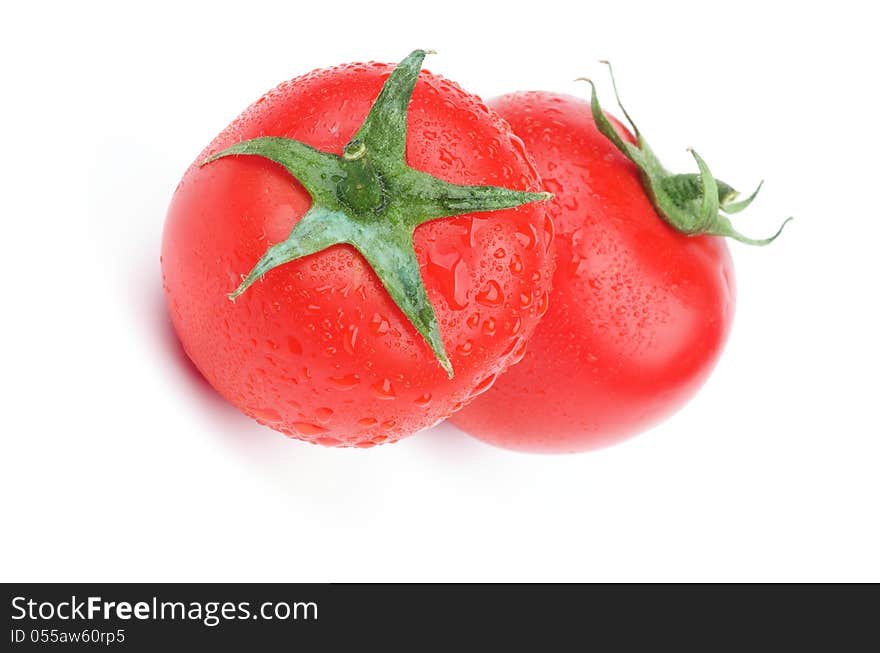 Two Perfect Raw Tomatoes with Stems and Droplets isolated on white background. Two Perfect Raw Tomatoes with Stems and Droplets isolated on white background