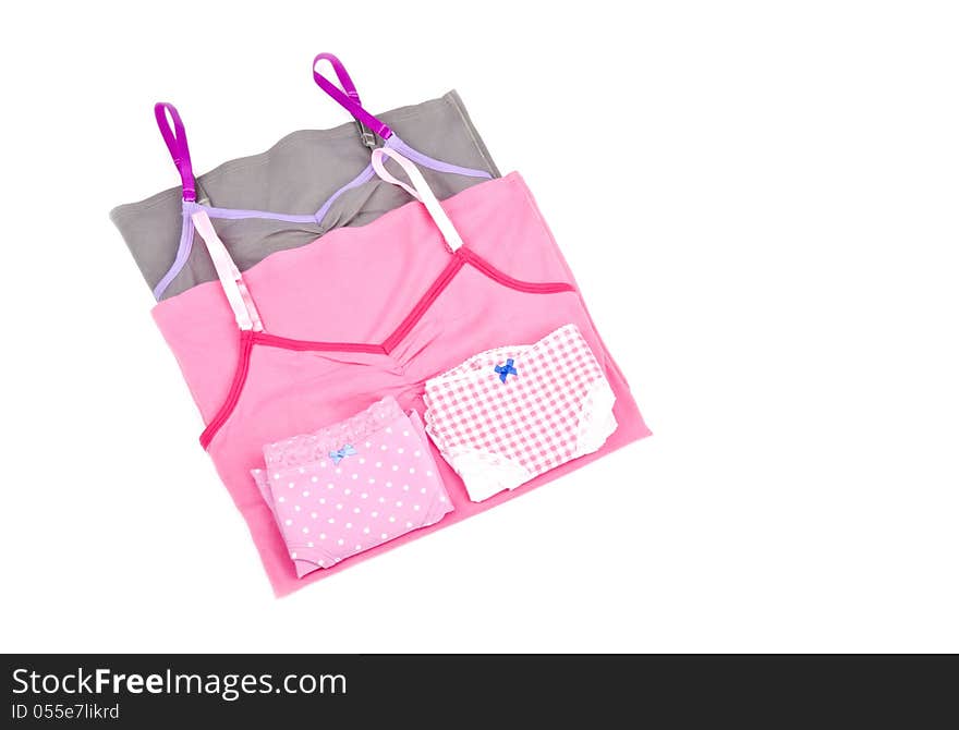 One polka dot and one checker design panties and a pink and gray tank top. One polka dot and one checker design panties and a pink and gray tank top.