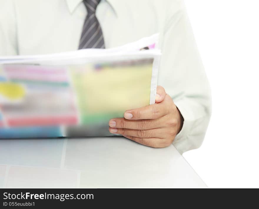 Businessman reading a newspaper On the desk