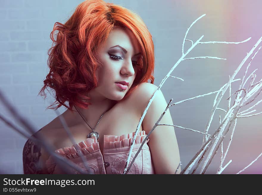 Sensual young women with red hairs posing in studio. Sensual young women with red hairs posing in studio