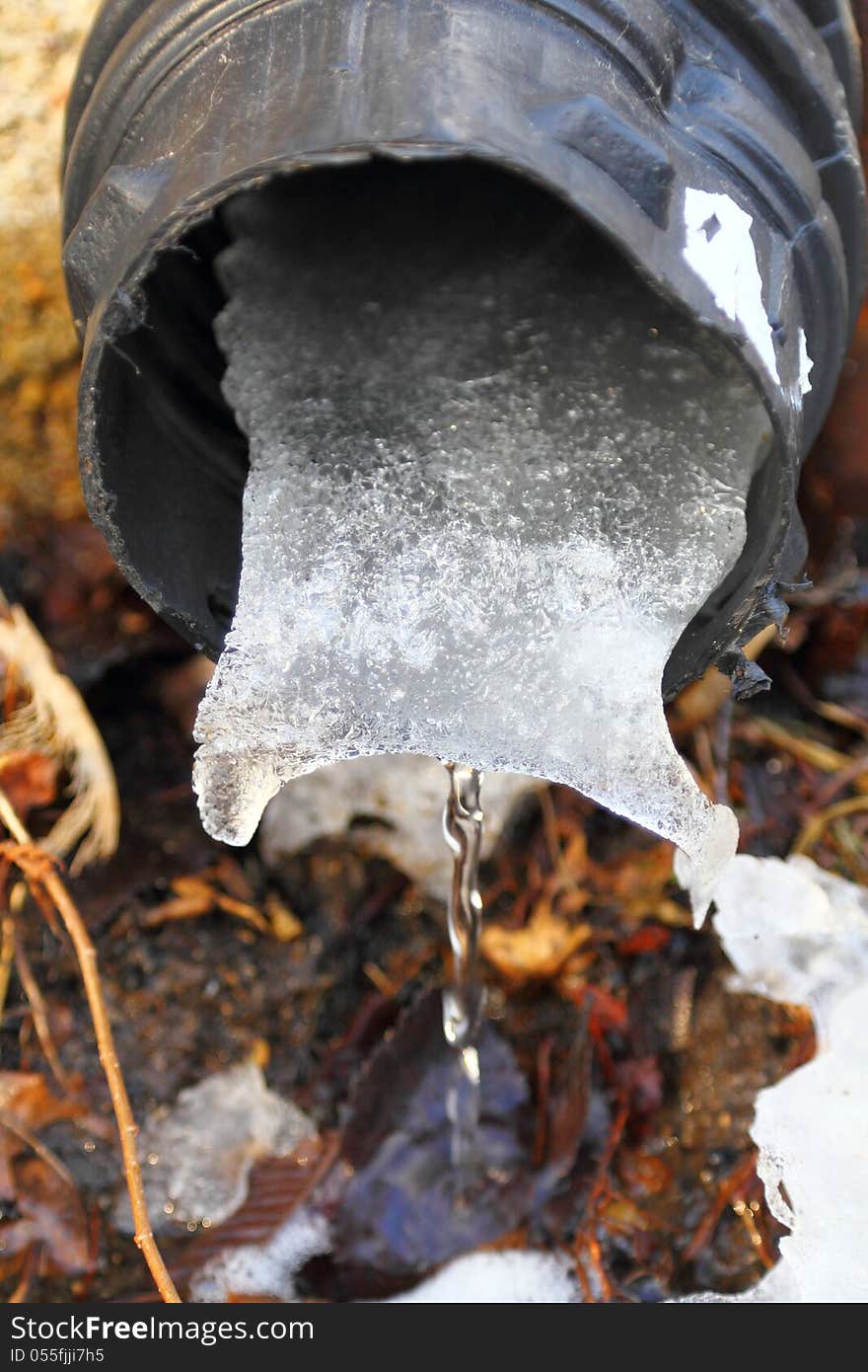 Melting snow and ice clogged in plastic drainage pipe. Melting snow and ice clogged in plastic drainage pipe.