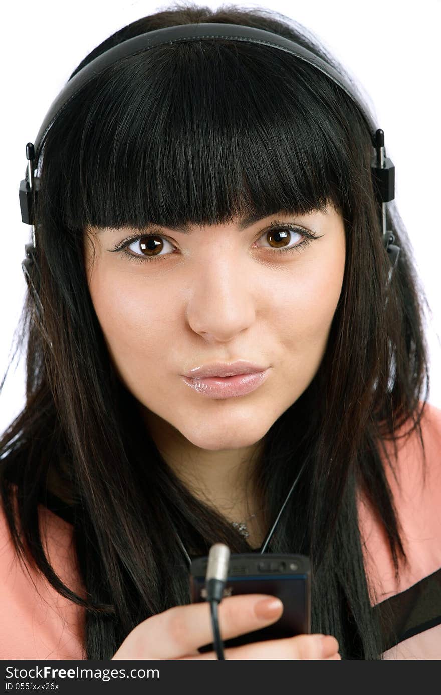 Beautiful young woman with headphones listen music, isolated on white background