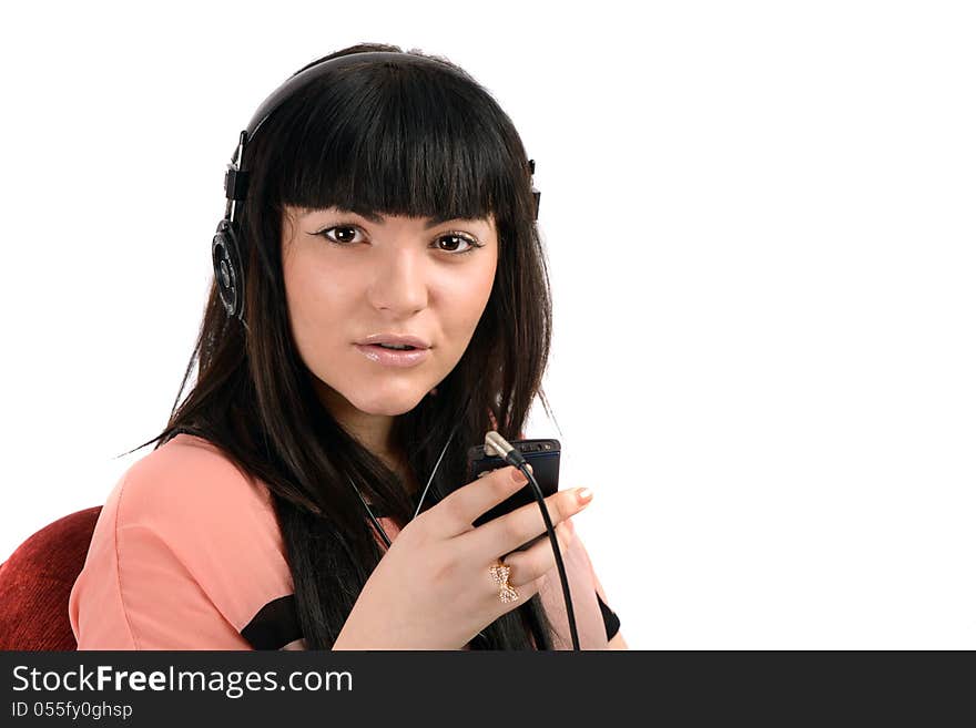 Beautiful young woman with headphones listen music, isolated on white background