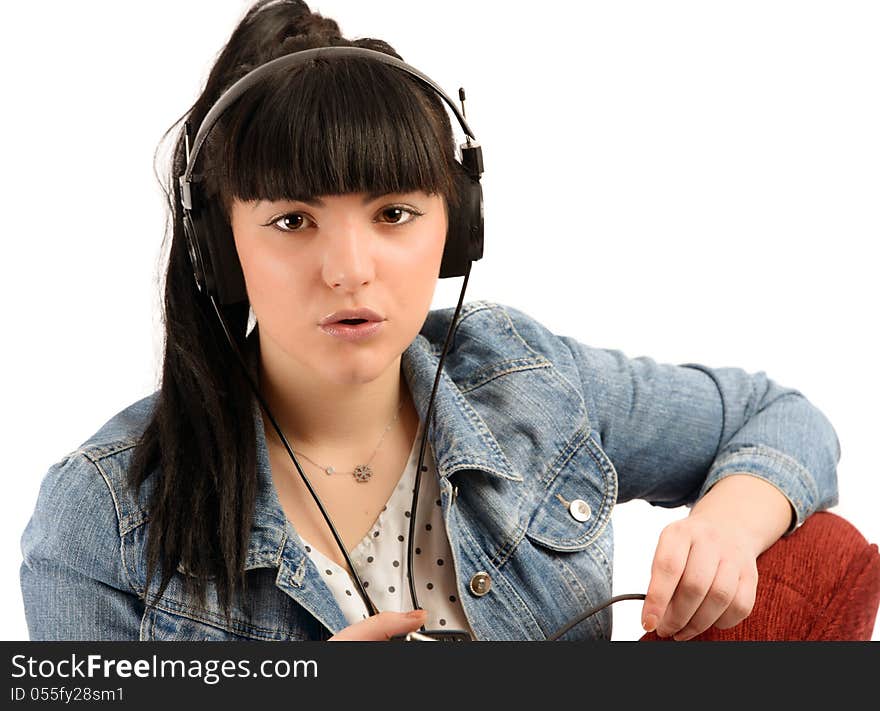 Beautiful young woman with headphones listen music, isolated on white background