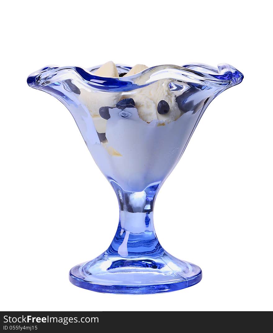 Ice cream with bilberry in a blue glass ice-cream bowl isolated on white