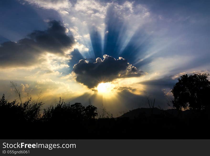 Image of sun shine through rain cloud. Image of sun shine through rain cloud