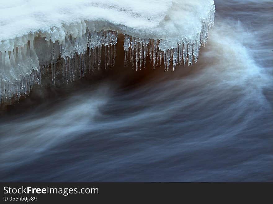 Water flow with icicles in Vantaa- river in Finland. Water flow with icicles in Vantaa- river in Finland