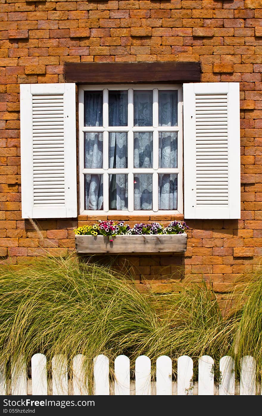 White window with brick wall