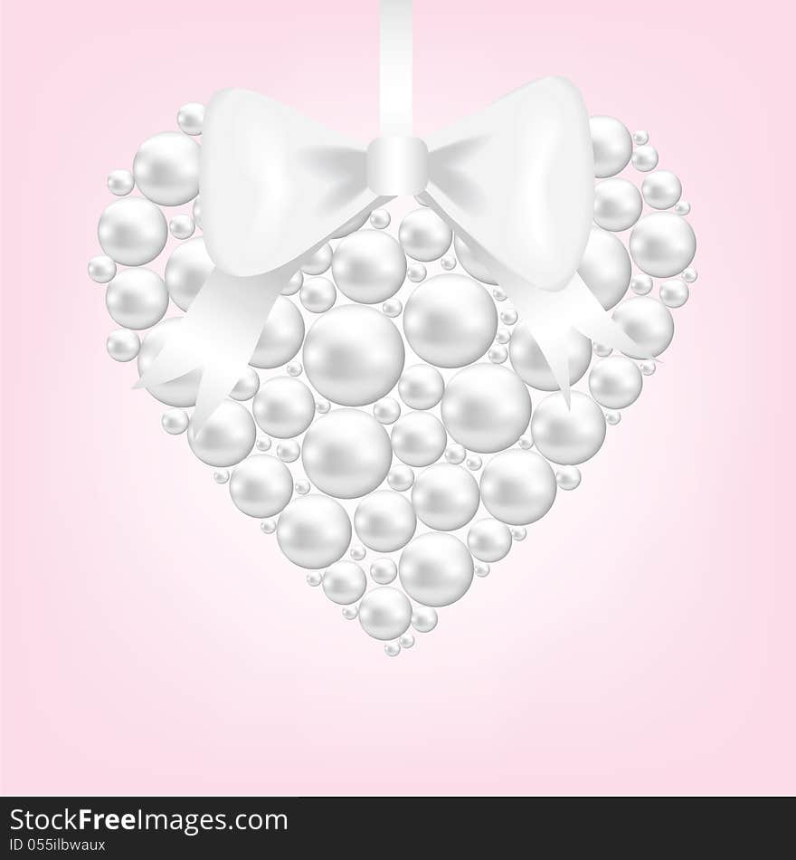 Pearl heart with bow on pink background