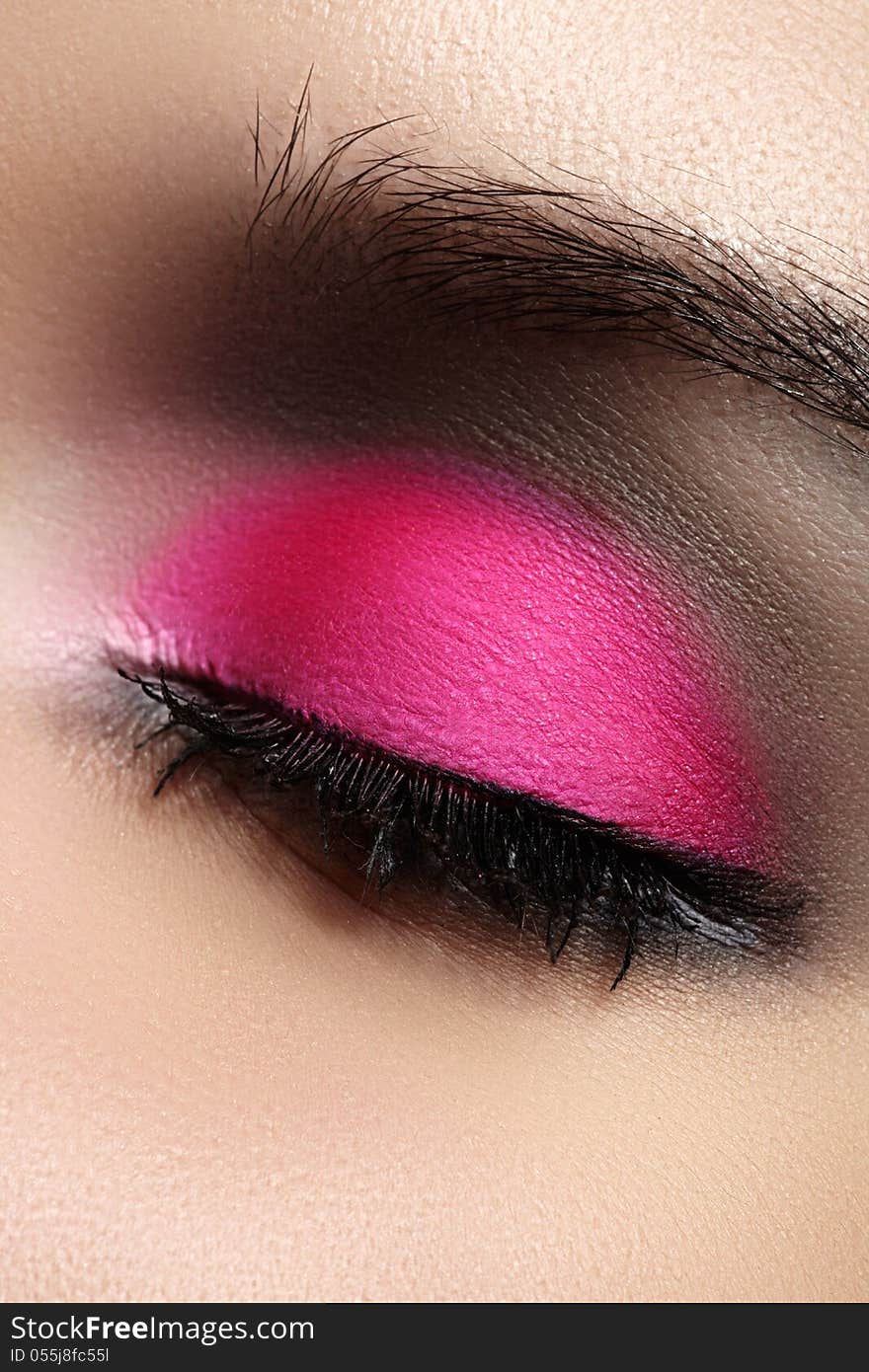 Close-up of fashion eyes make-up, bright pink eyeshadow