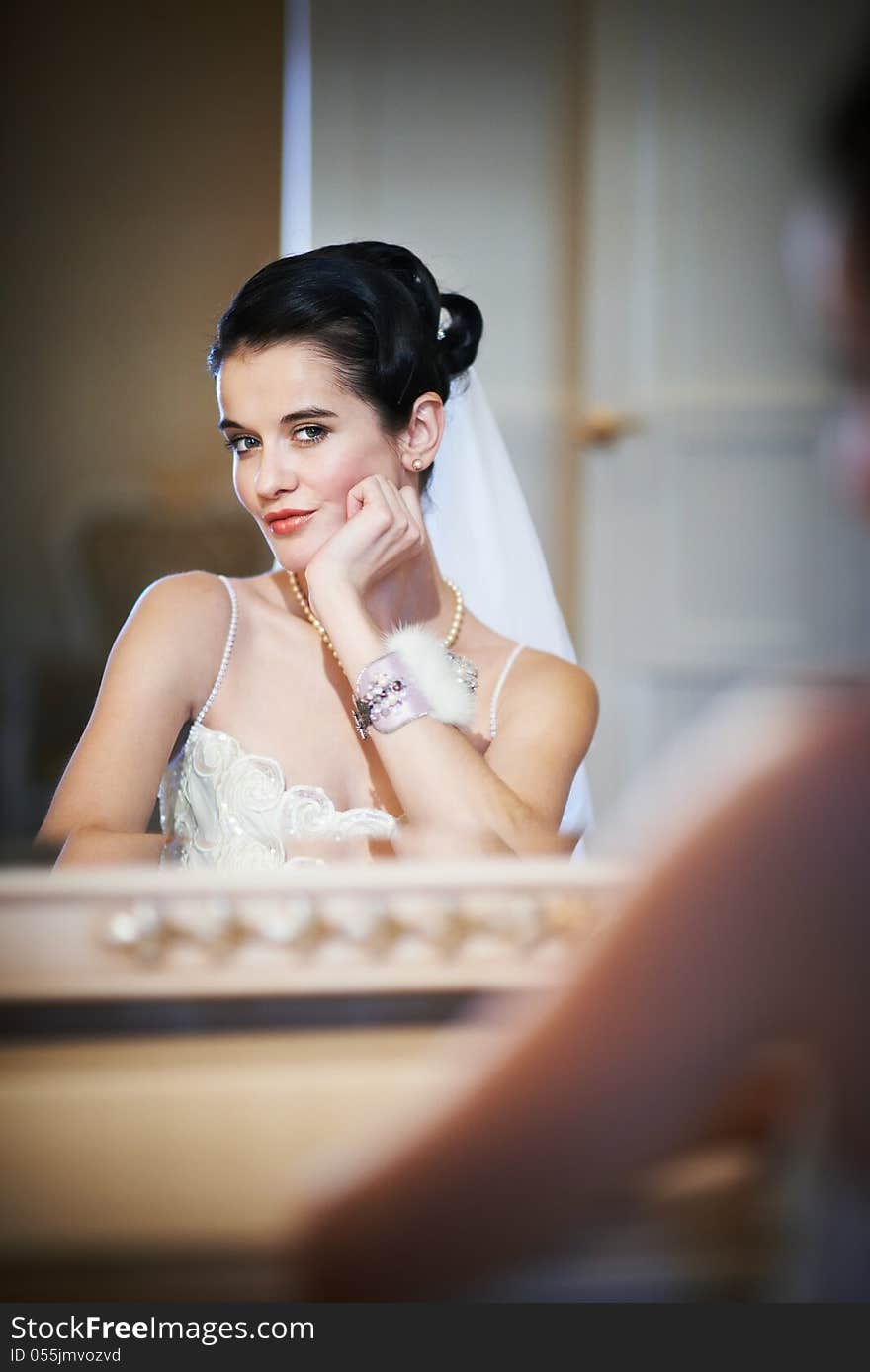 Beautiful Bride Sitting Near Mirror