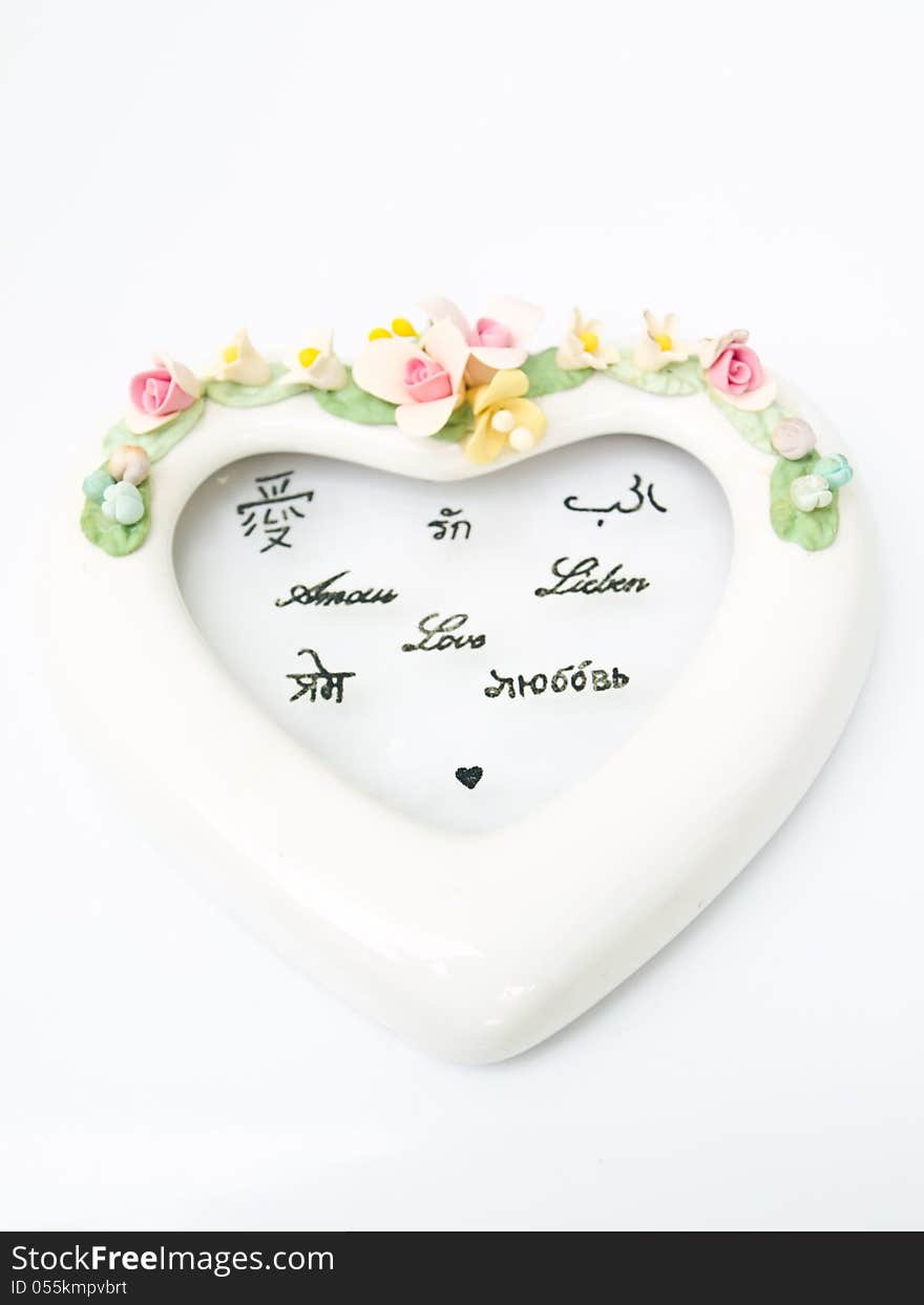 A white ceramic hearth with various language meaning of love on white