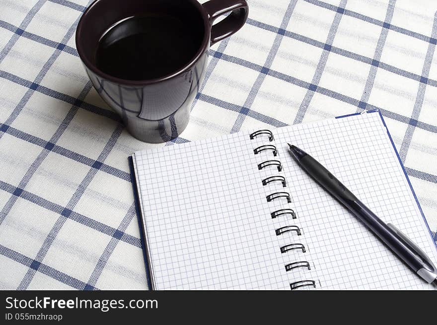 Notebook lying on the tablecloth