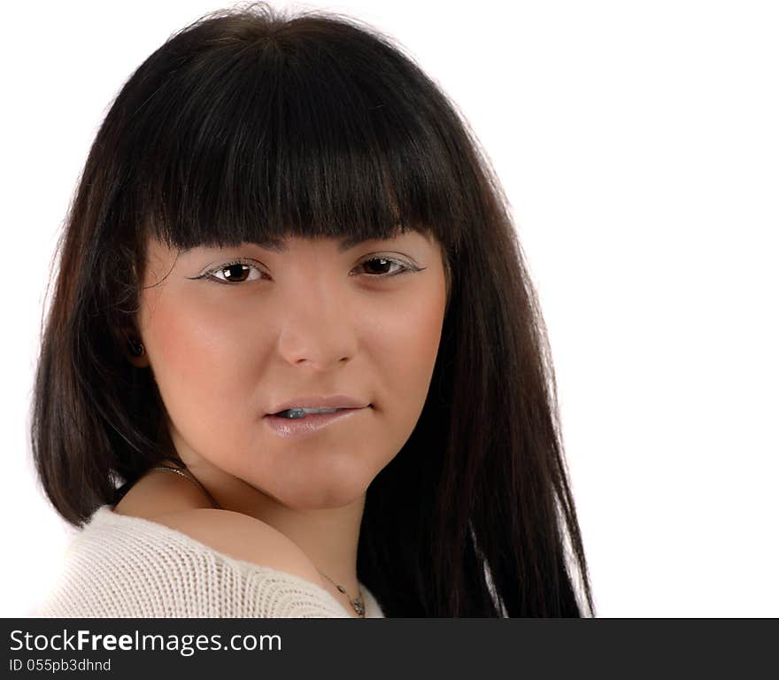 Portrait of a young brunette in studio