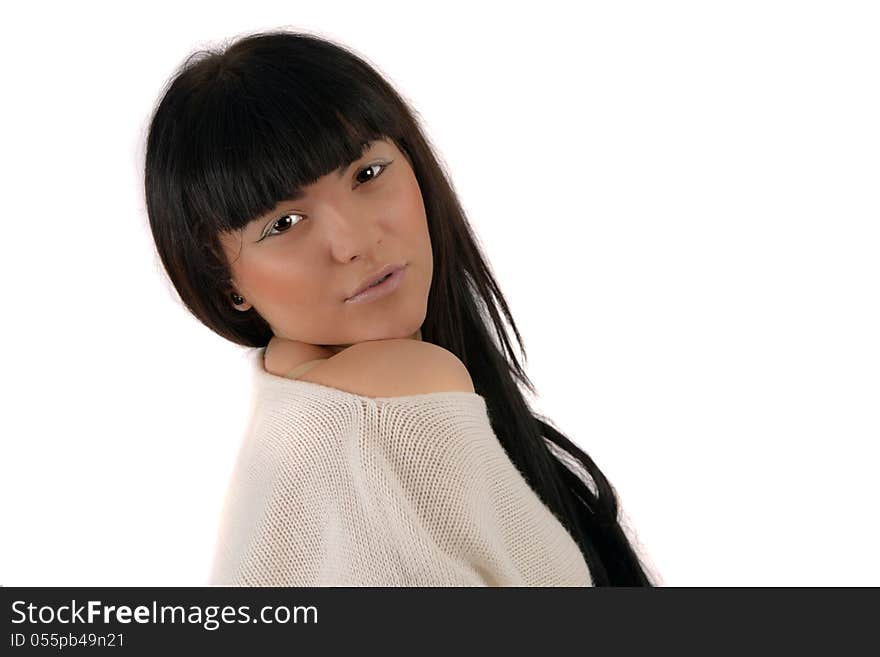 Portrait of a young brunette in studio