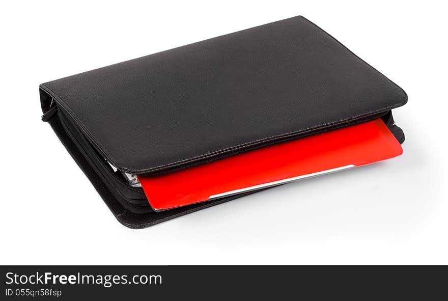 Black leather diary with a colourful red tab for organizing and scheduling your time or taking notes  on white