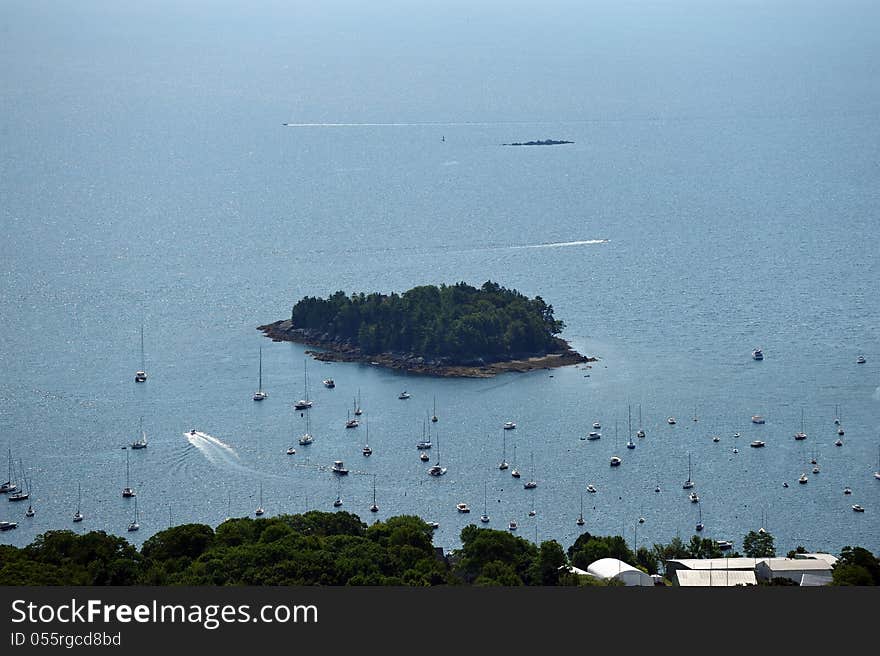 Mountain top view of many sailboats in a safe harbor on the Maine coast. Mountain top view of many sailboats in a safe harbor on the Maine coast