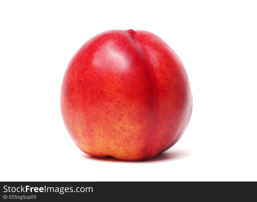 Single nectarine isolated on a white background