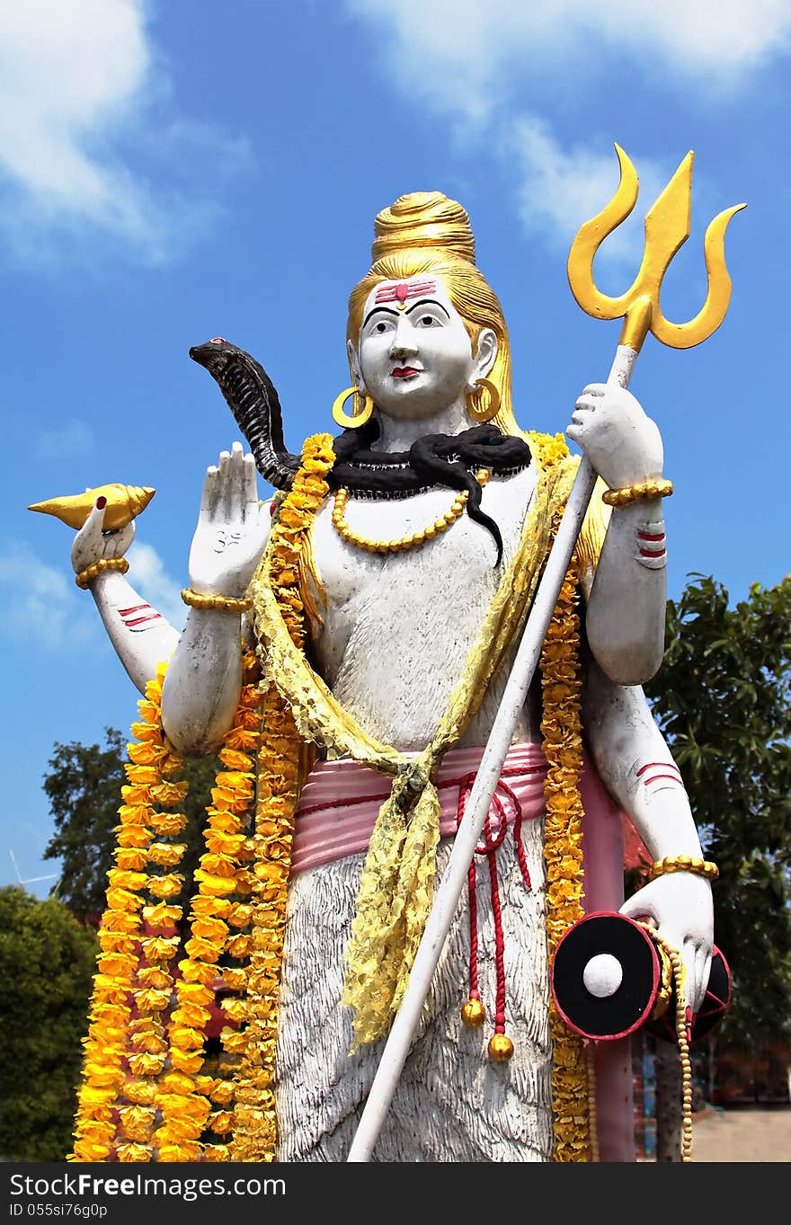 Lord Shiva statue on blue sky background